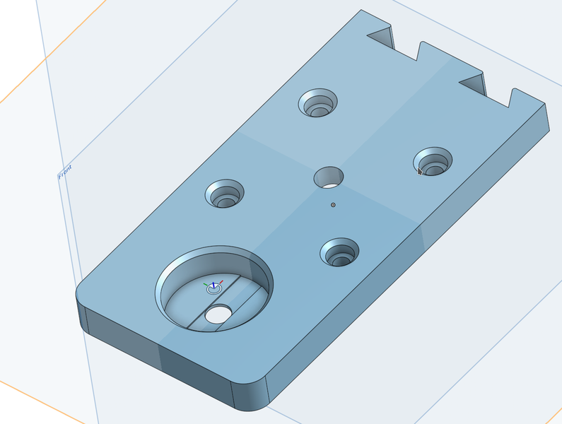 Screenshot of CAD showing a recessed section with a hole in the middle. There
is a strip of material chopped out of the round recessed section, one layer
thick, across the hole, constructing two bridged sections next to the hole.